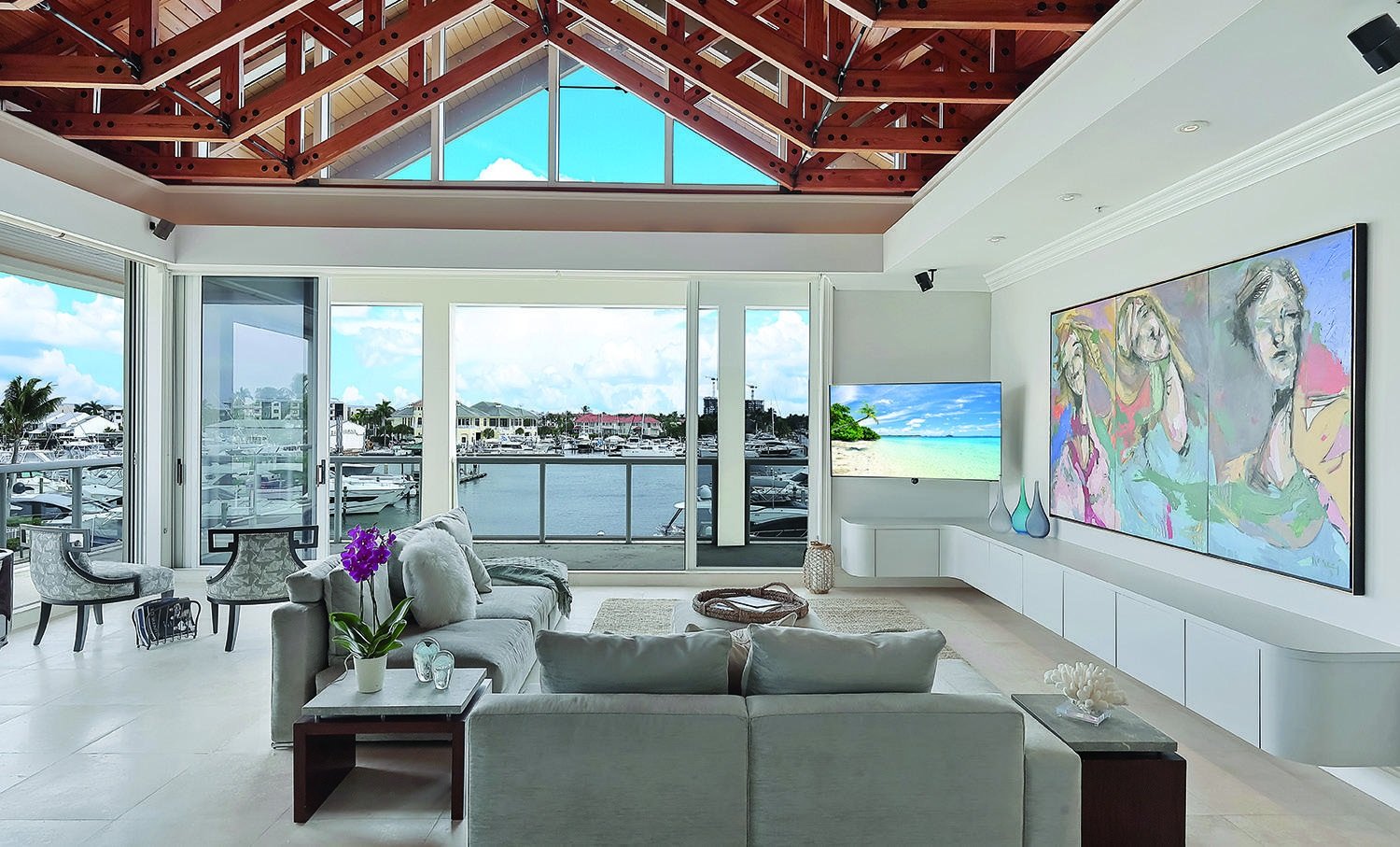 Coastal living room with a vaulted timber ceiling and waterfront view